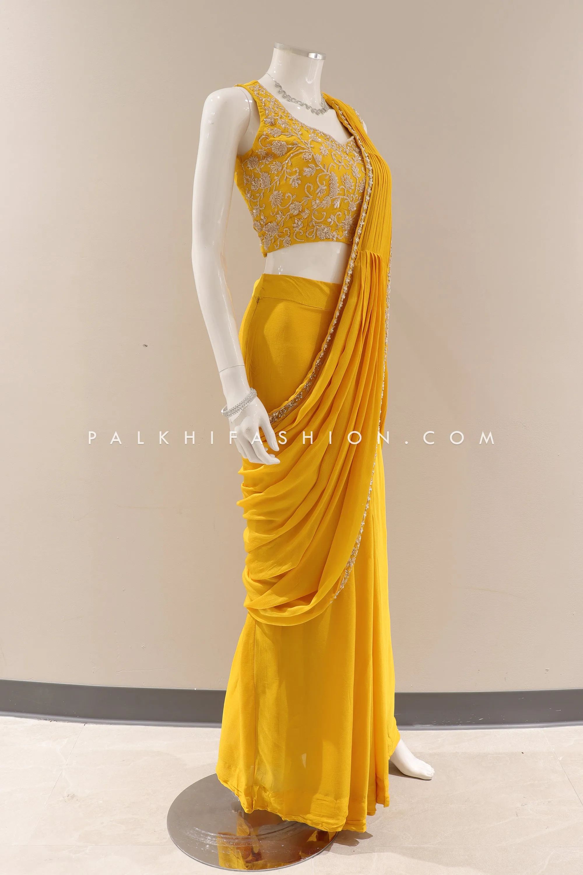 Lavish Traditions: Pre-Pleated Saree with Intricate Embellishments