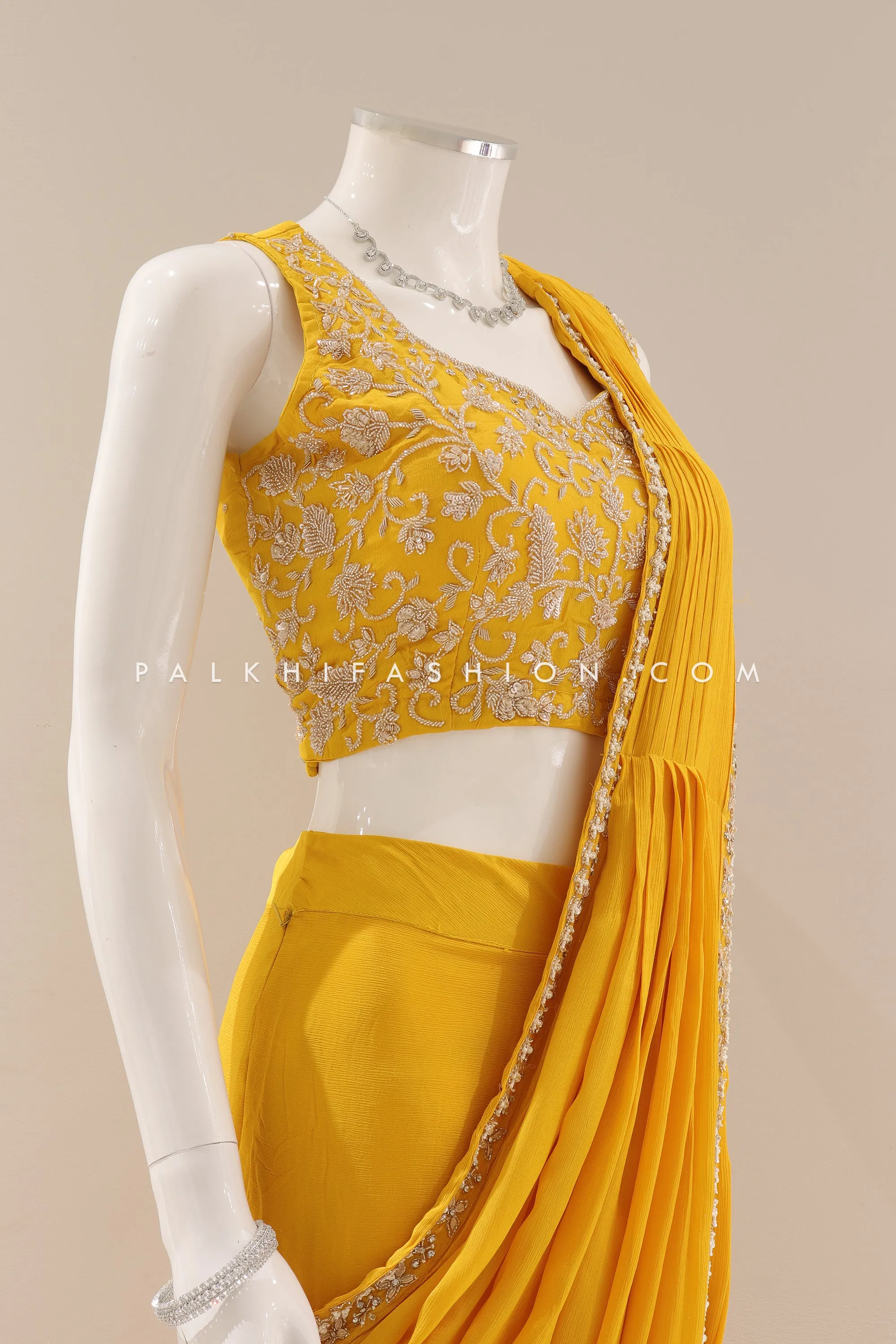 Lavish Traditions: Pre-Pleated Saree with Intricate Embellishments