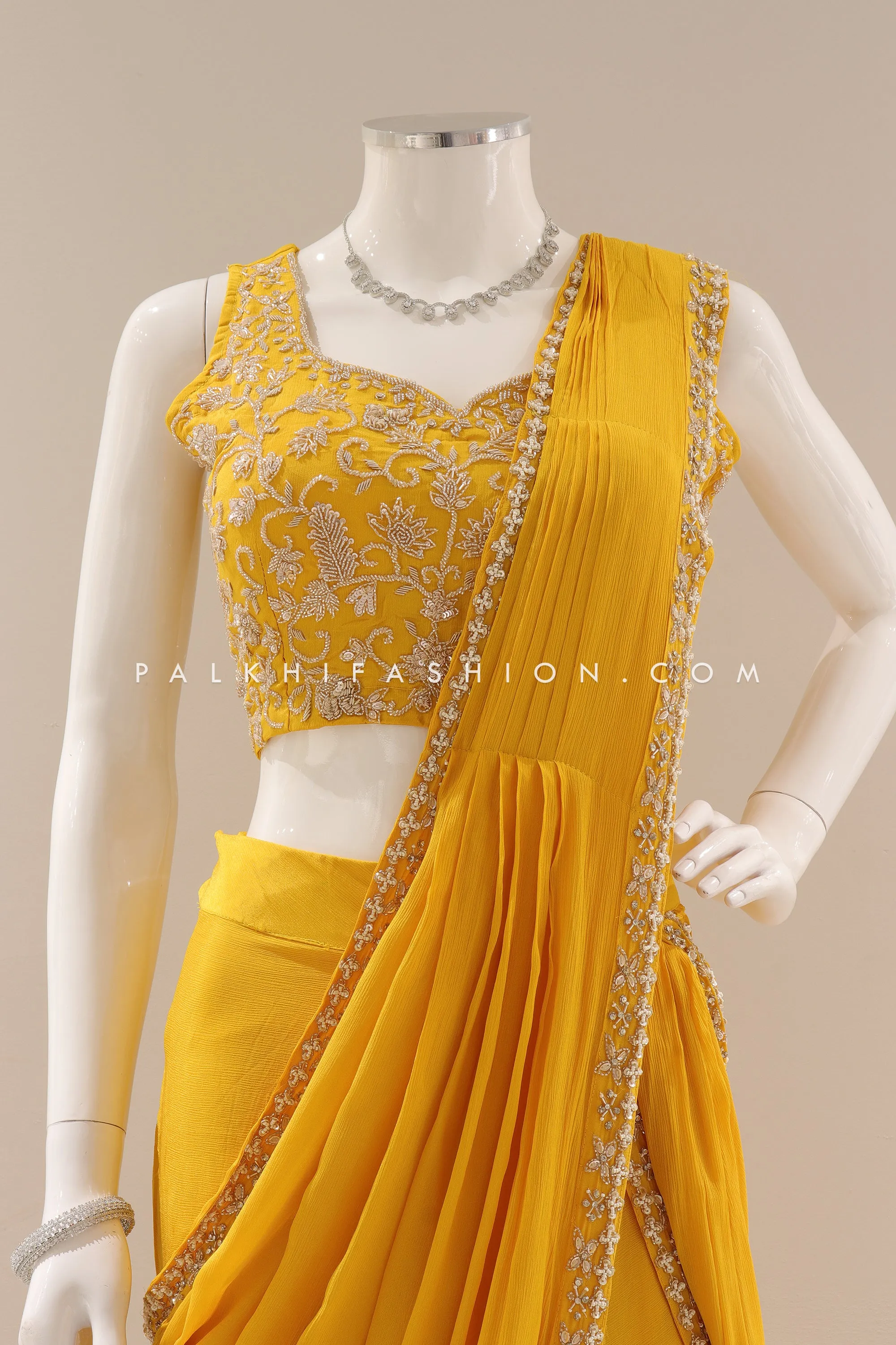 Lavish Traditions: Pre-Pleated Saree with Intricate Embellishments