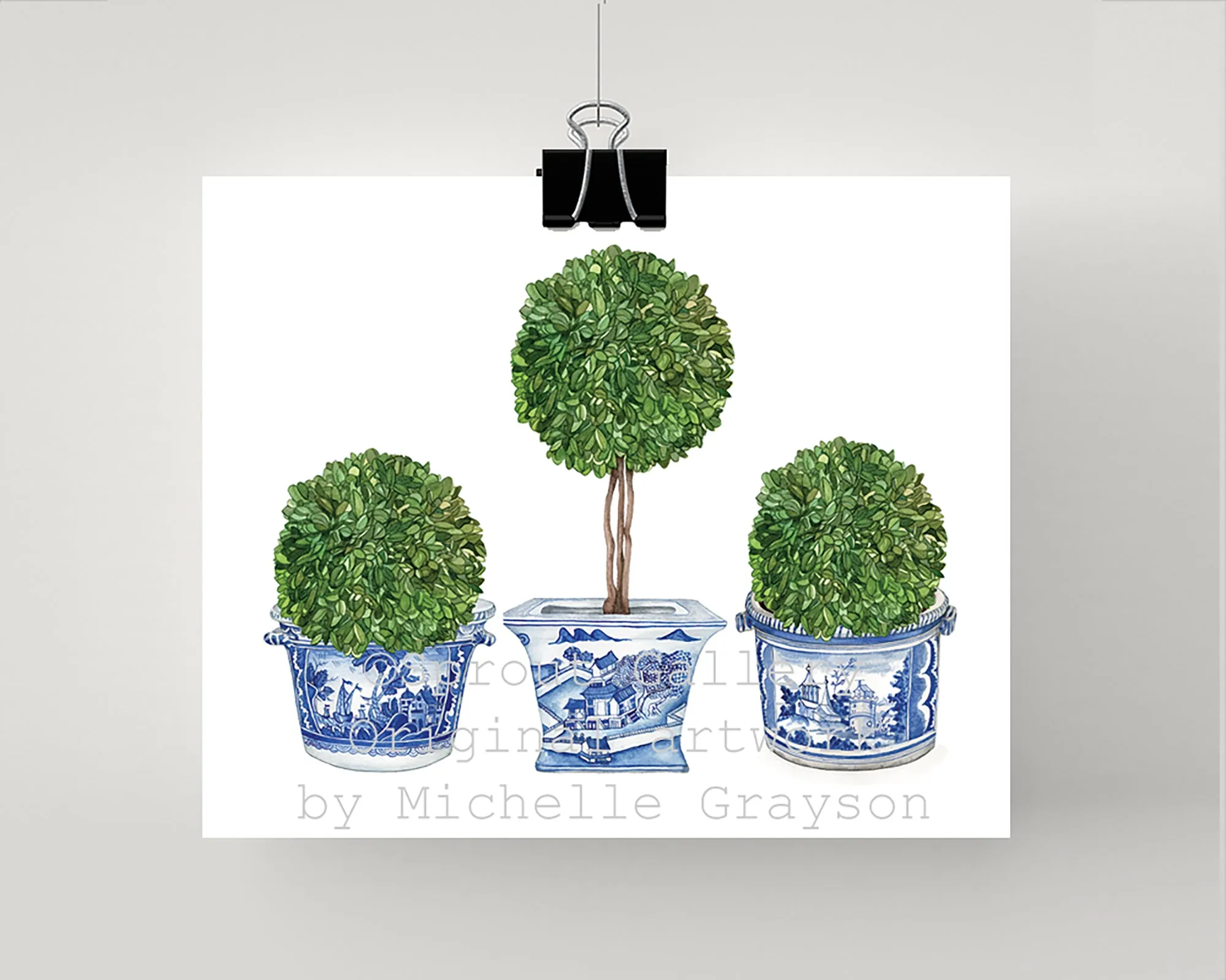 Print of three topiary trees in blue and white antique pots